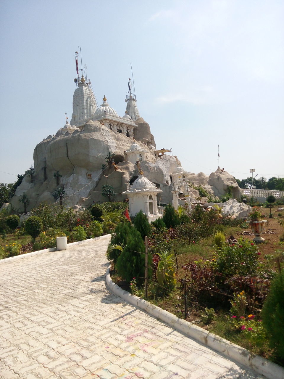 architecture, building exterior, built structure, place of worship, religion, spirituality, church, sky, dome, clear sky, cathedral, tree, history, famous place, travel destinations, temple - building, day, cross