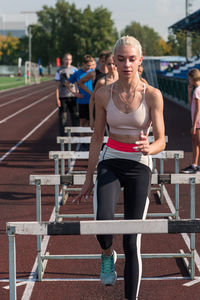 Side view of woman exercising in park