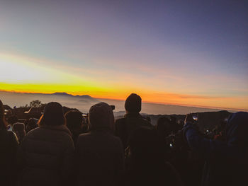 Silhouette people at sunset