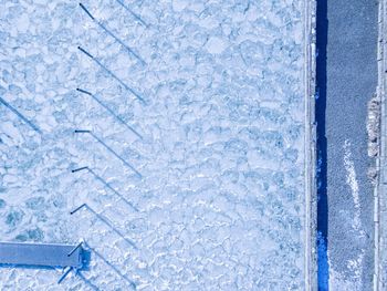 Full frame shot of icicles on glass window