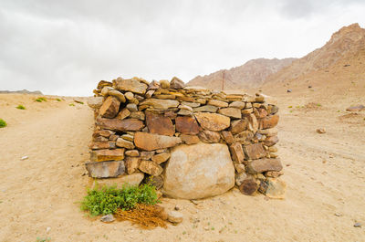 Rock formations on landscape against sky