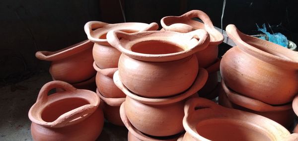 Close-up of pots for sale in workshop