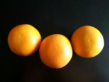 High angle view of oranges on table against black background