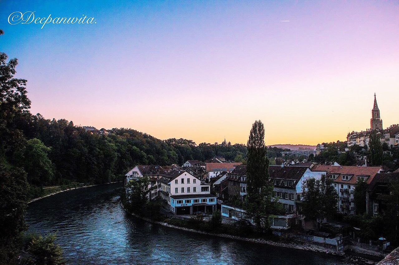 RIVER WITH BUILDINGS IN BACKGROUND