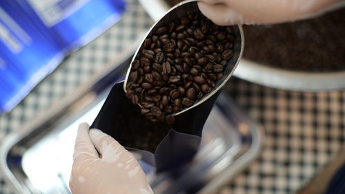 Close-up of hand holding coffee cup
