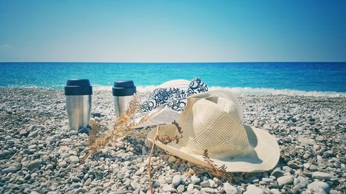 Scenic view of beach against clear blue sky