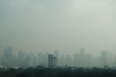 Modern buildings in city against sky