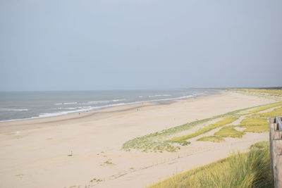 Scenic view of beach against clear sky