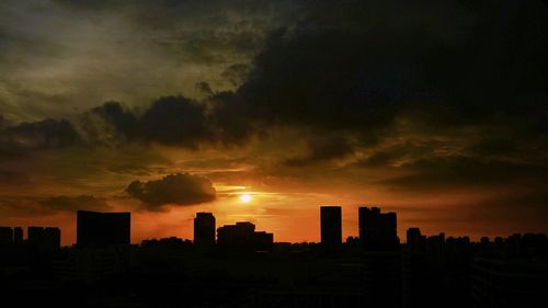 Scenic view of city at sunset