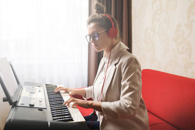 Young woman using laptop at home