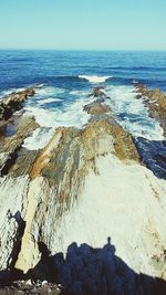 Close-up of beach against sky