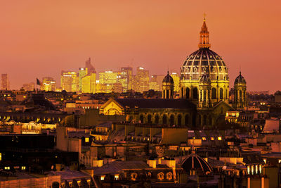 High angle view of city lit up at night