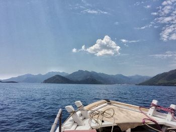 Boats sailing in sea against sky