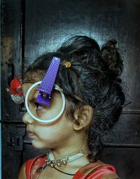 Close-up portrait of woman wearing sunglasses