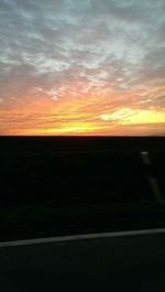 Silhouette landscape against sky during sunset