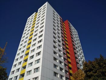 Low angle view of buildings against blue sky