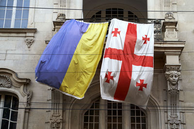 Low angle view of flag on street