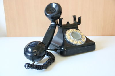 Close-up of vintage telephone on table