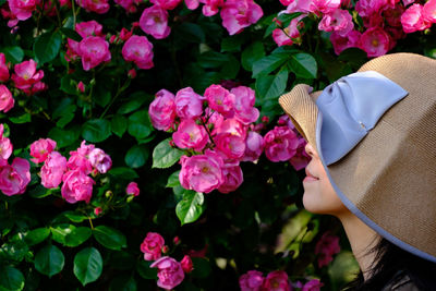 Midsection of woman with flowers