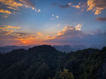 Scenic view of silhouette mountains against sky at sunset