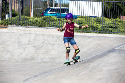 Skater girl carves at the skatepark