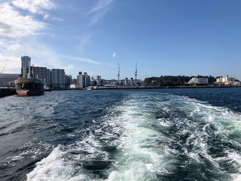 Scenic view of sea and buildings against sky