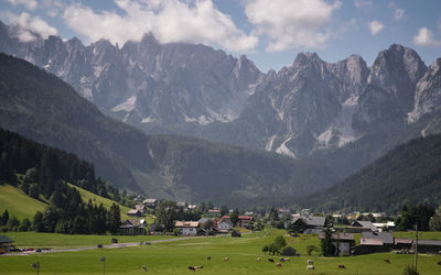 Panoramic view of houses and mountains against sky
