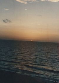 Scenic view of sea against sky at sunset