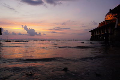 Scenic view of sea against sky at sunset