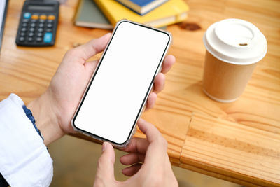 Cropped hands using digital tablet