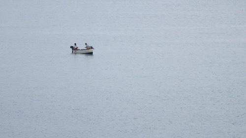 People in boat on water