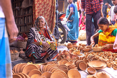 Group of people at market stall