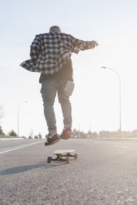 Young man skateboarding in the street