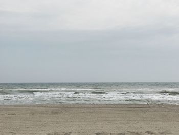 Scenic view of beach and sea against sky