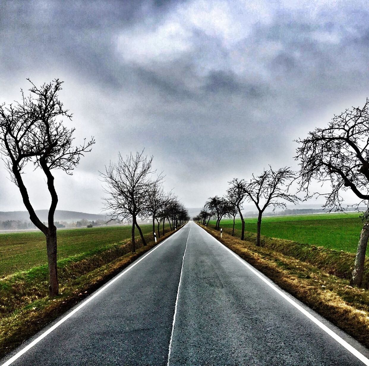 EMPTY ROAD ALONG LANDSCAPE