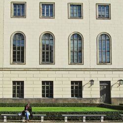 Woman standing in front of building