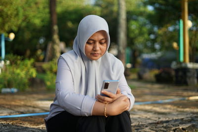 Young woman using mobile phone