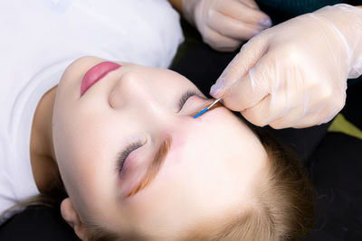 Cropped image of doctor examining patient