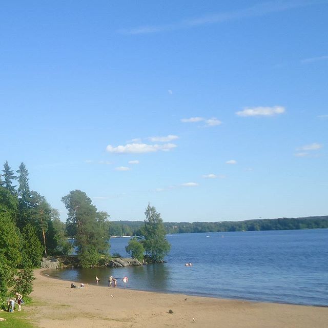 water, tree, blue, sky, tranquility, tranquil scene, beach, scenics, nature, beauty in nature, sea, shore, sand, incidental people, day, lake, idyllic, outdoors, river, built structure