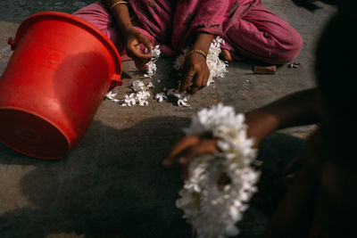 High angle view of people sitting on floor