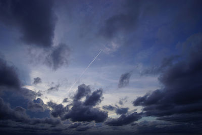 Low angle view of vapor trails in sky