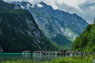 Scenic view of lake and mountains against sky