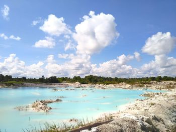 Scenic view of sea against cloudy sky