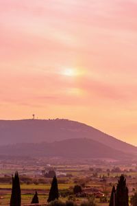 Scenic view of landscape against sky during sunset