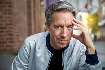 Portrait of man sitting outdoors
