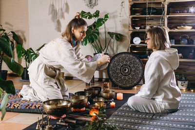 Portrait of female friends sitting at home