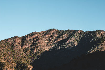 Low angle view of mountain against clear sky