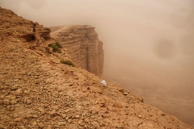 Rock formations on landscape against sky