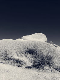 Scenic view of desert against clear sky