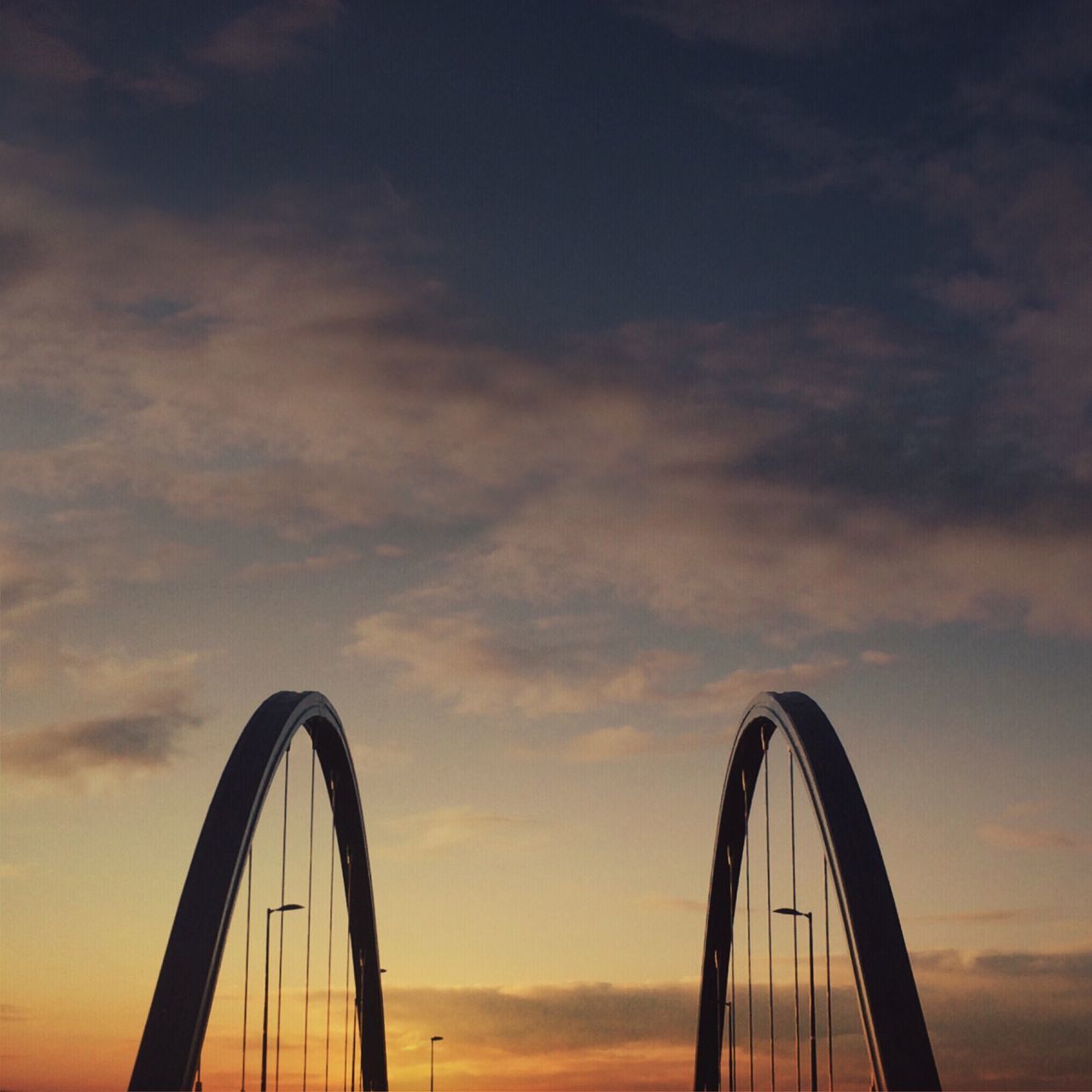 sunset, sky, transportation, silhouette, cloud - sky, mode of transport, bicycle, orange color, part of, low angle view, cloud, land vehicle, dusk, cloudy, outdoors, nature, cropped, beauty in nature, ferris wheel, tranquility